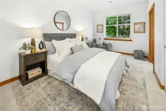 The main-floor primary suite offers the convenience of an en-suite bath and easy access to everyday living. Ideal for those seeking main-level living with the flexibility of additional space upstairs for guests or a home office. The main level features the primary bedroom and bath, a well-appointed kitchen, comfortable living room, powder bath with laundry, and direct access to the private two-car garage.