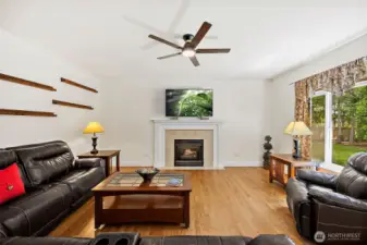 Gas fireplace offers a focal point and a touch of warmth during cooler months.(This room is partially virtually staged)