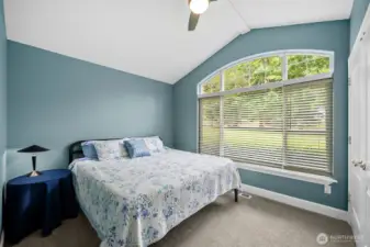 The inviting colors of this bedroom serve as a perfect retreat for rest and rejuvenation. In addition to it's beautiful aesthetics, it offers plenty of room for this king-sized bed, and features a stylish double door closet thats not only practical, but also adds an element of elegance to the rooms overall design.