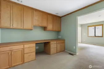 Studio area off bonus room with custom built in cabintry
