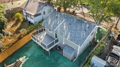 Beautiful new roof, deck and fence.