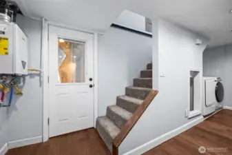 Downstairs you'll fild a tankless water heater, laundry, and access to back yard.