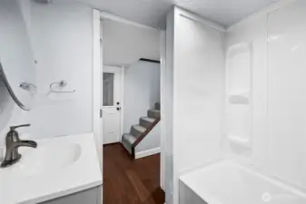 Downstairs full bath, located in downstairs foyer.