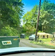 Park here, just before dumpster.
