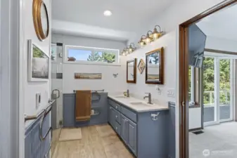 Fantastic bath off the primary with radiant heated floors, heated towel bar, dual vanity, and large walk in closet.