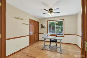 Large den/office with French doors on the main floor with a big closet.