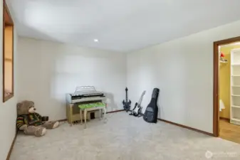 Music room  or flex space with a large walk in closet.