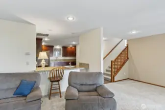 Looking towards the downstairs kitchen.  There is an eating bar.