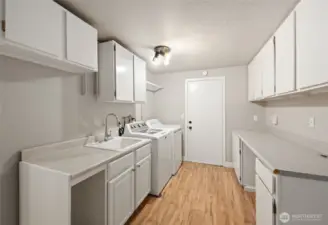 down stairs utility room that is roomy enough to alter to a kitchen