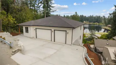 Front of home and lake over-sized 3 car garage