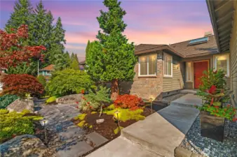 An inviting front door envoloped by the high end landscaping designed by renowned PNW landscape designer.