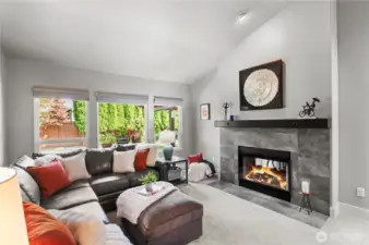 Your living area features incredible windows and a double-sided fireplace enveloping both sides of the house in warmth and beauty