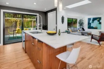 The center island seats four. Chop and chat with friends while preparing a meal, or sip your morning coffee while catching up on the news of the day. The home has two dishwashers, which makes hosting large dinner parties a breeze.