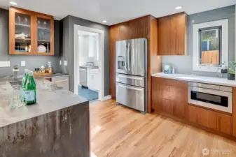 The bar area to the left has a built-in sink that also serves as a beverage cooler.