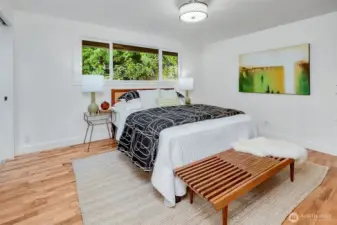 Primary bedroom with an ensuite bath with a tiled & glass steam shower.