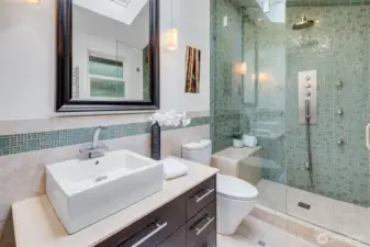 Retreat to the spa-inspired steam shower, a daily luxury.