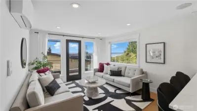 Light filled living room with lots of windows and a deck to take advantage of the views.