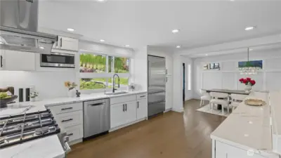 The kitchen opens seamlessly to the dining  room for easy flow entertaining.