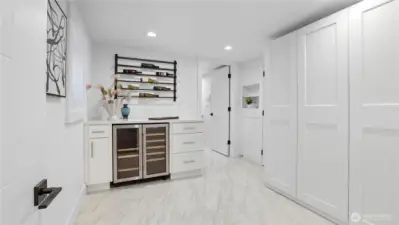 Versatile space for wine room, hobby room, or crafts room with storage.