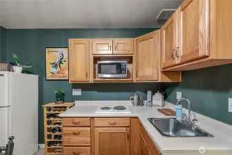 Compact kitchenette with storage and appliances—ideal for guests or multi-gen living