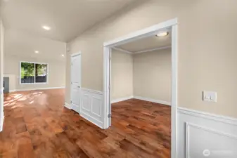 A dedicated and generously sized home office just off the entrance with french doors.