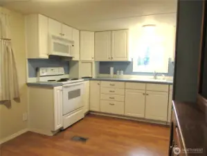 ALL UPDATED KITCHEN CABINETS AND APPLIANCES, LAMINATE FLOORING.