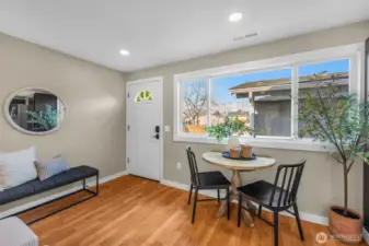 Beautiful laminate hardwood floors & dimmable recessed lighting throughout the home make it warm & welcoming.