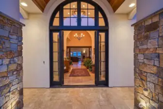 The floor is rare large tiles of tumbled limestone. The foyer serves as an art gallery as well as the areas that bridge each of the living spaces.