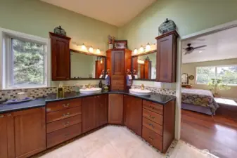 Stained cherry cabinets with two sinks and turn table in center cabinet.