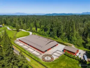 View of Arena facility with Eurociser, storage barn and upstairs apartment.