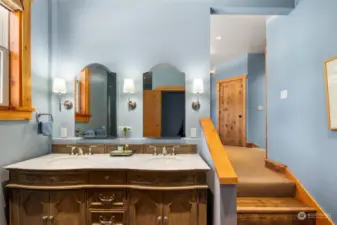 ADU/apartment bath with double sinks and tiled shower.