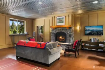 Heated lobby with fireplace and viewing area overlooking the indoor arena.