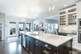 The kitchen is designed for intimate gatherings with friends or larger groups to mingle and hang out. There is plenty of room for everyone to enjoy the space. The built-in wine fridge is conveniently located on the outskirts of the Chef's cooking domain.  The perfect entertainer's kitchen!