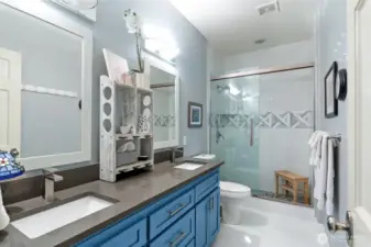 Full bath fully renovated with walk in shower, double sinks and stylish vanity next to Bedroom #2.