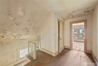 The upper level of the home has damage to the walls, ceilings, and floors.