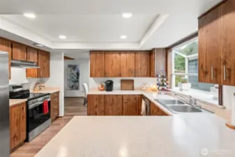 The kitchen spans the dining room and family room for enjoyable connection while preparing meals.