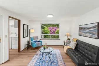 The west facing window to the family room frames a beautiful rhododendron garden.