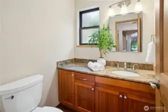 The updated powder room with granite counters.