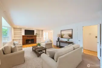 Cozy living space with plenty of light, French doors to a covered patio off of the dining room. Photo is virtually staged.