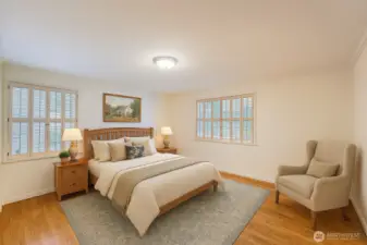 Main floor bedroom, cozy space with natural light. Photo is virtually staged.