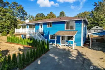 Beautifully remodeled home with two floors, carport, extra parking and yard w/garden & shed