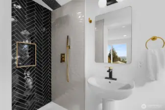 Walk in shower, custom tilework and gold trimmings