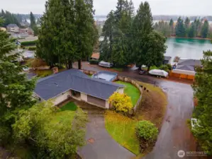 Welcome to this lovely home sitting on an elevated corner lot with panoramic views of Lake Tapps, nestled among a serene and peaceful neighborhood.