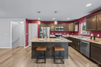 spacious kitchen with bar eating and additional eating space available