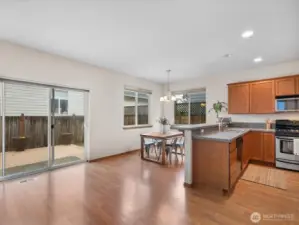 Generous open plan living area flooded with natural light leading to dining nook flooded with natural light and sliding doors leading to your own deck and private back yard - all adjacent to your modern kitchen - perfect for entertaining
