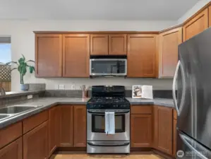 A kitchen that is a cook's delight for preparing meals - complete with solid wood cabinets and stainless-steel appliances.