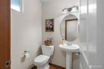 Classic, clean powder room that prioritizes space and light.