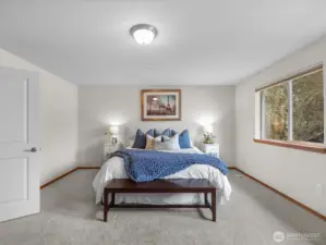 Enjoy a serene primary suite with soft, brand-new carpeting and an abundance of natural light, offering a peaceful and inviting retreat.