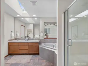 Primary bathroom is bright, light, and functional.