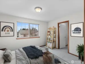 Bright and airy second bedroom filled with natural light from a large oversized window. Featuring brand NEW plush carpeting, neutral tones, and walk in closet, perfect for a nursery, office or guest retreat. VIRTUALLY STAGGED